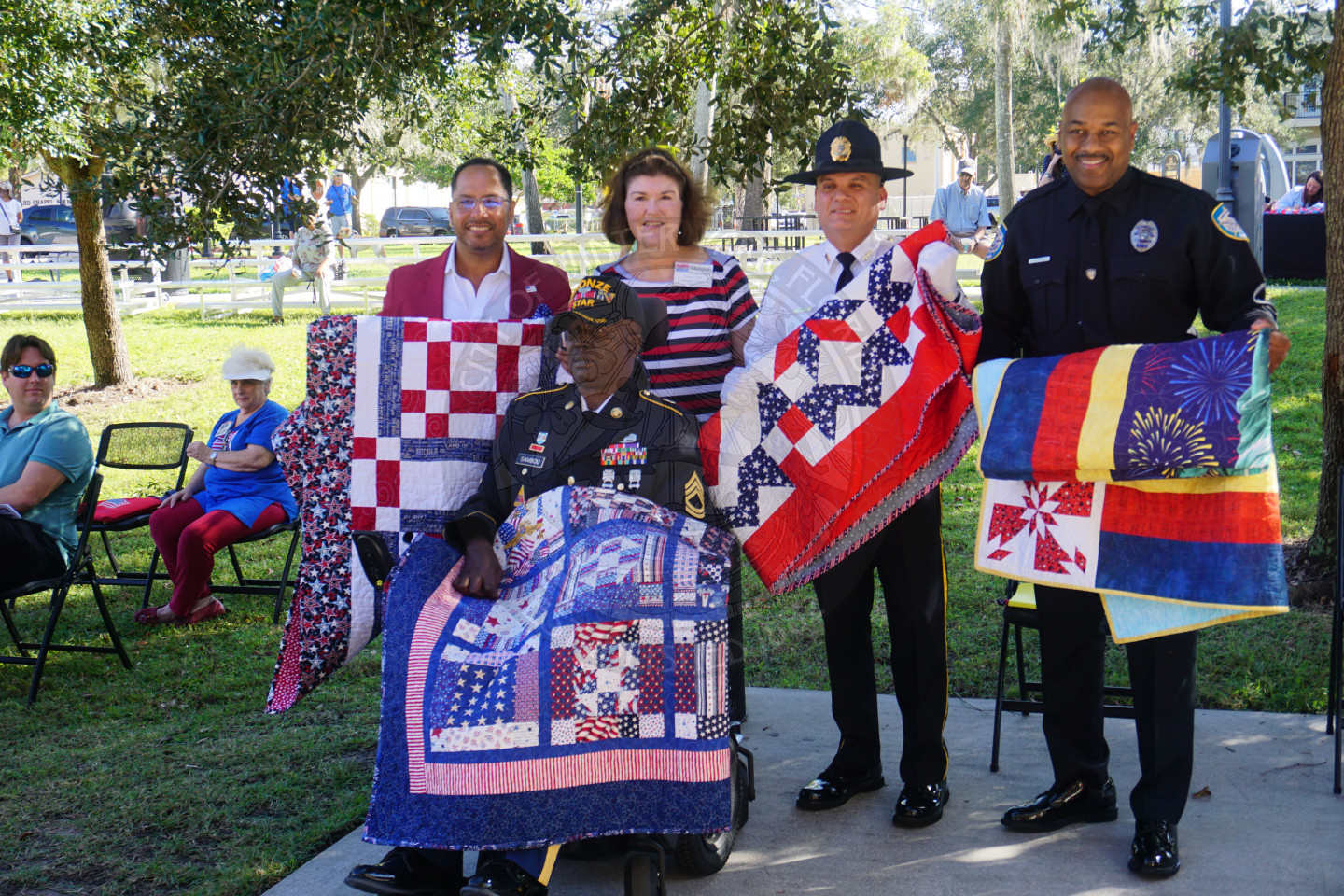 A group photo of recipeints quilts of valor.