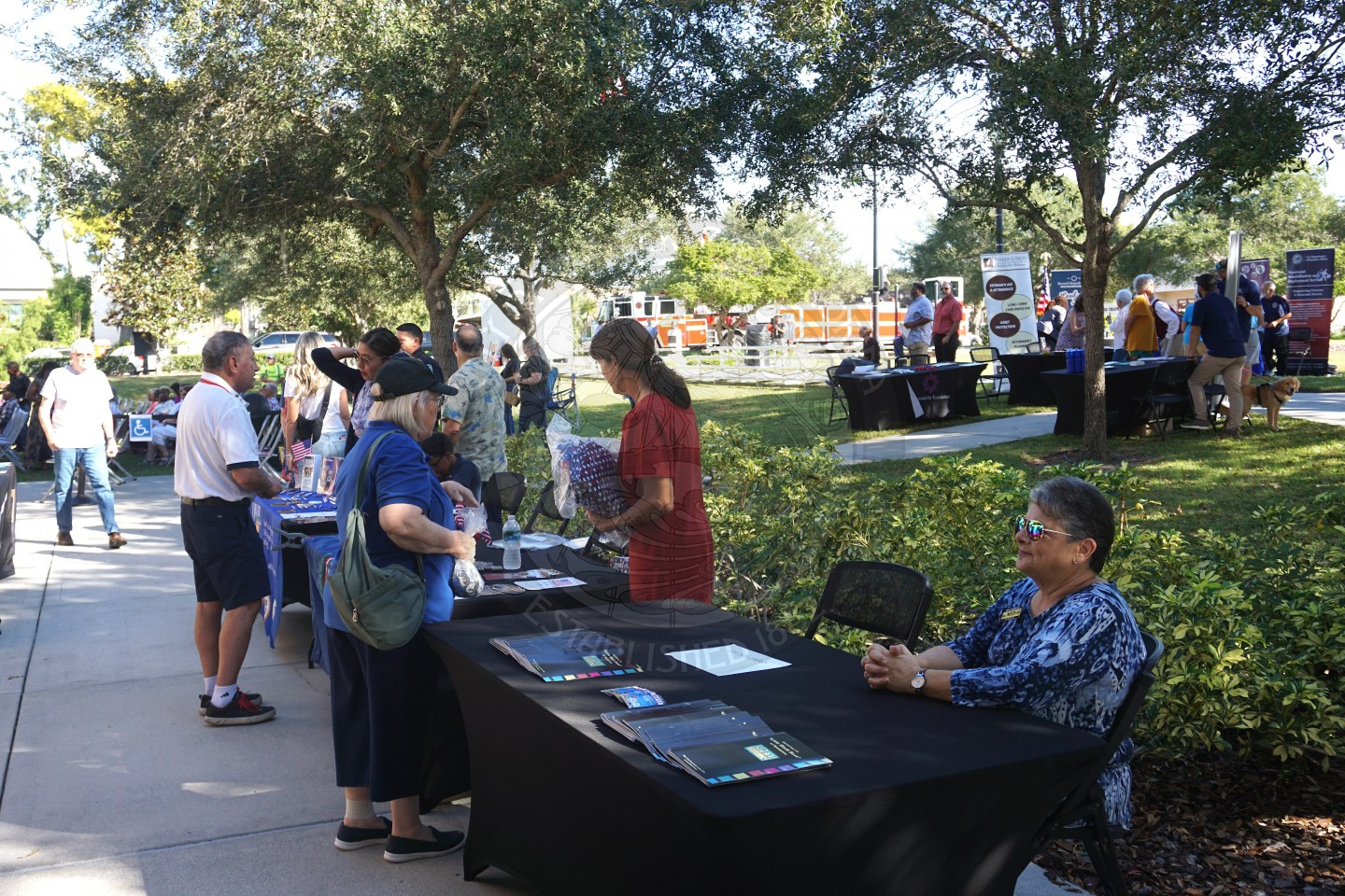 tables set up with people promoting their businesses.
