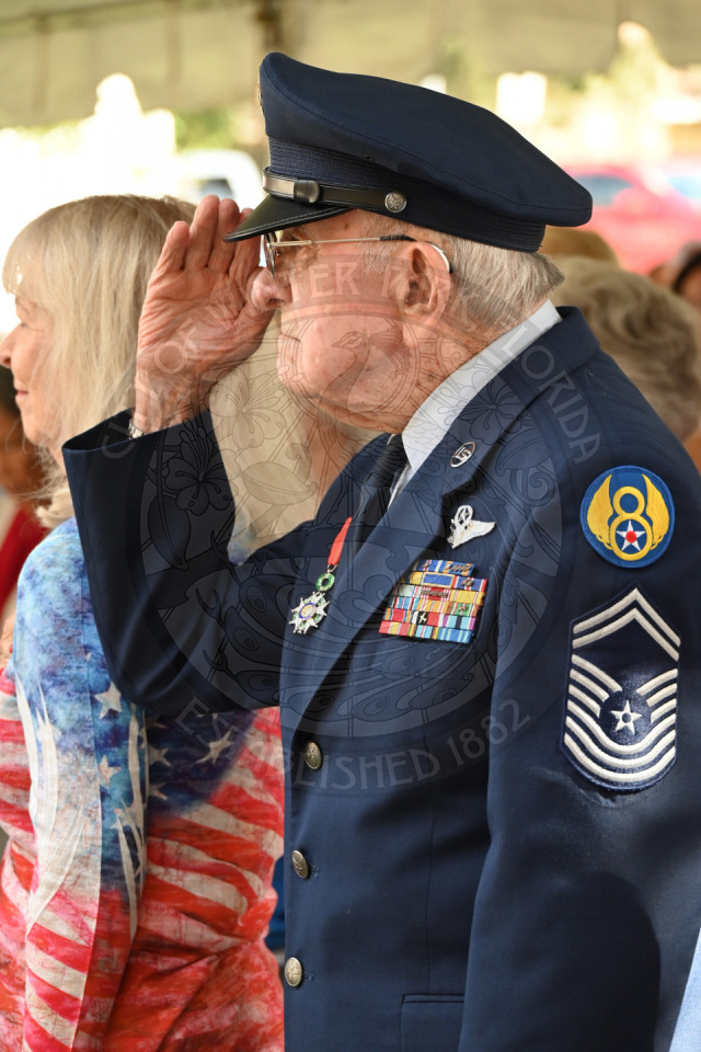 World War II Veteran saluting in his uniform. 