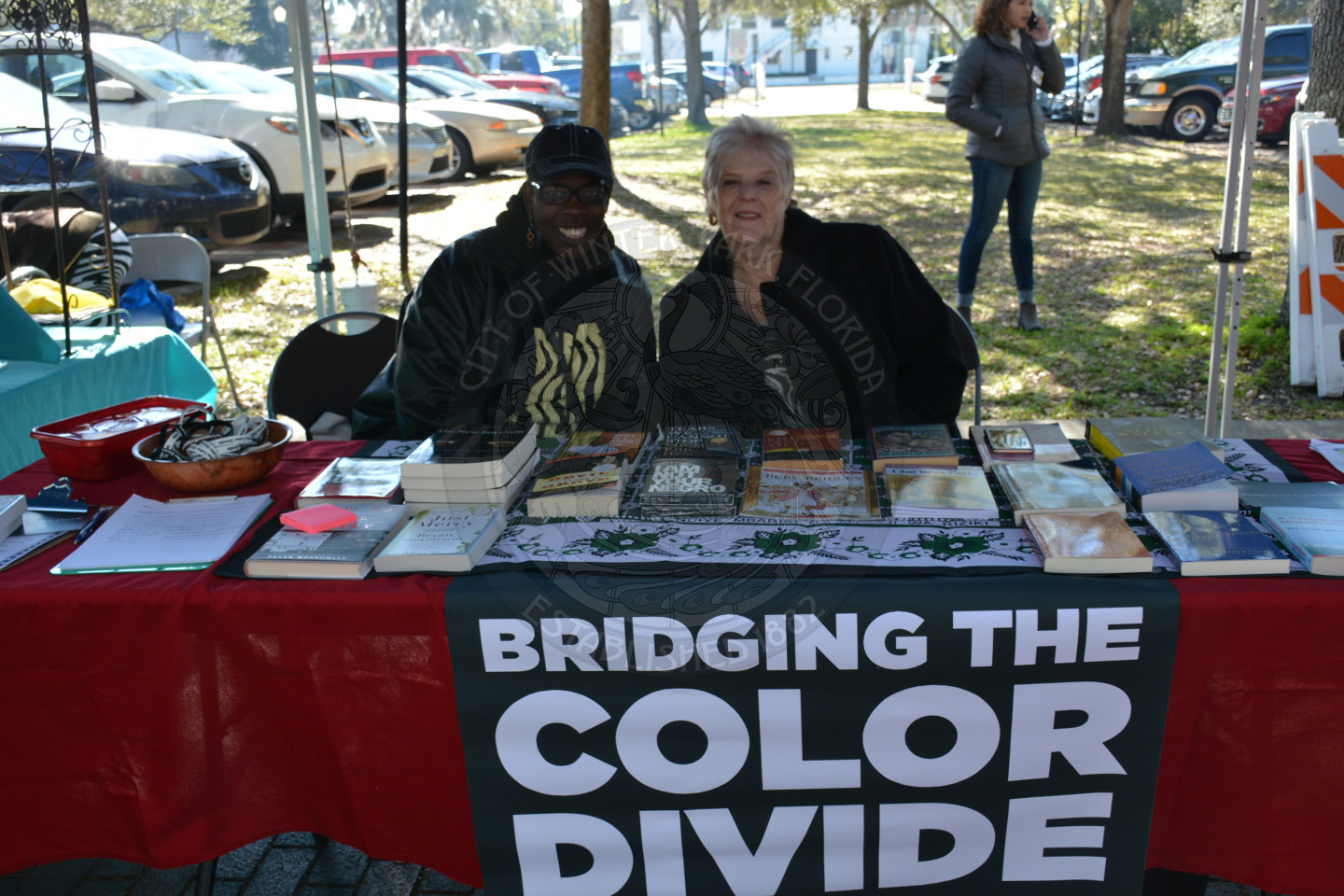 Two females seated at the Bridging the Color Divide table