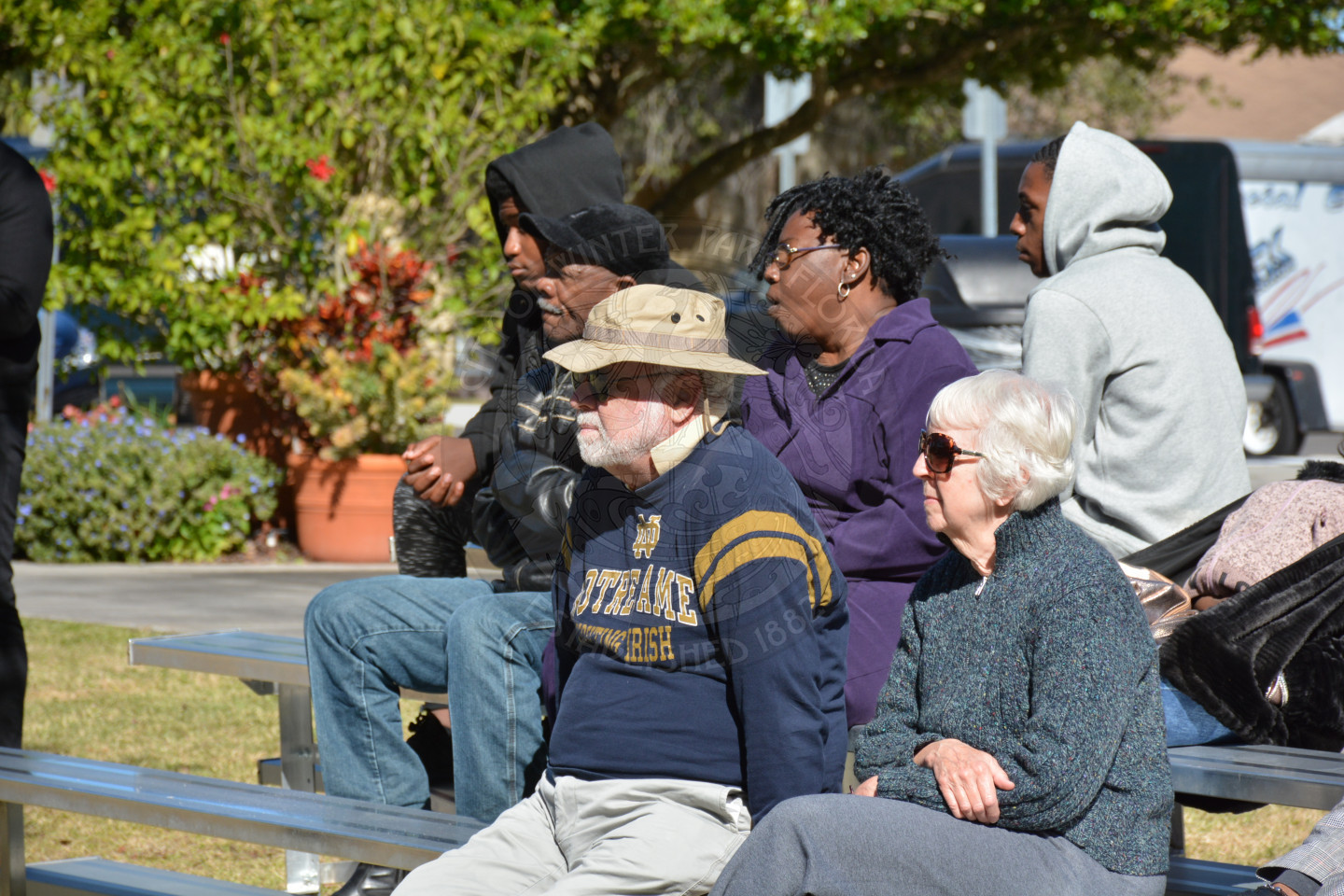Event attendees seated in bleacher area of the event
