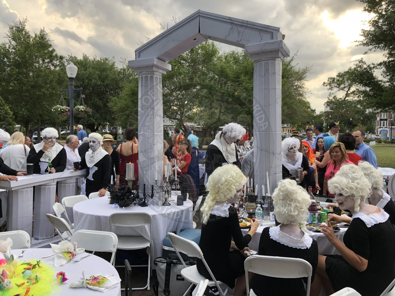 A table decord with people dressed in the appropriate theme.