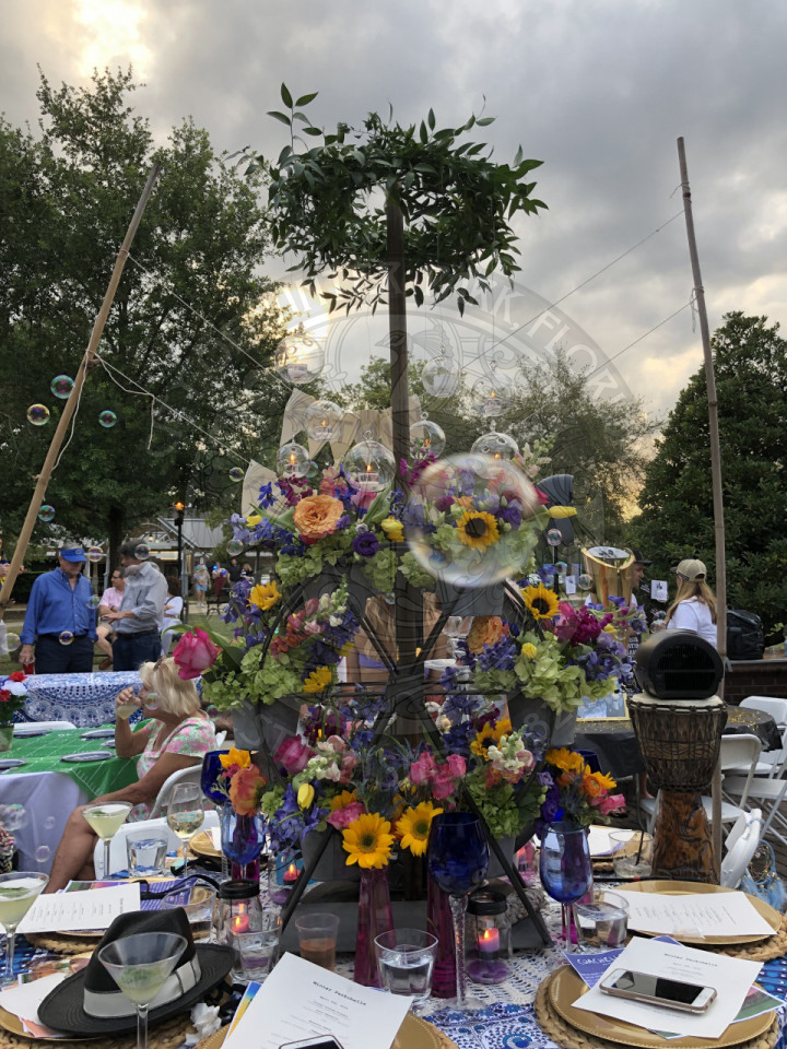 A flower themed table with bubbles floating around.