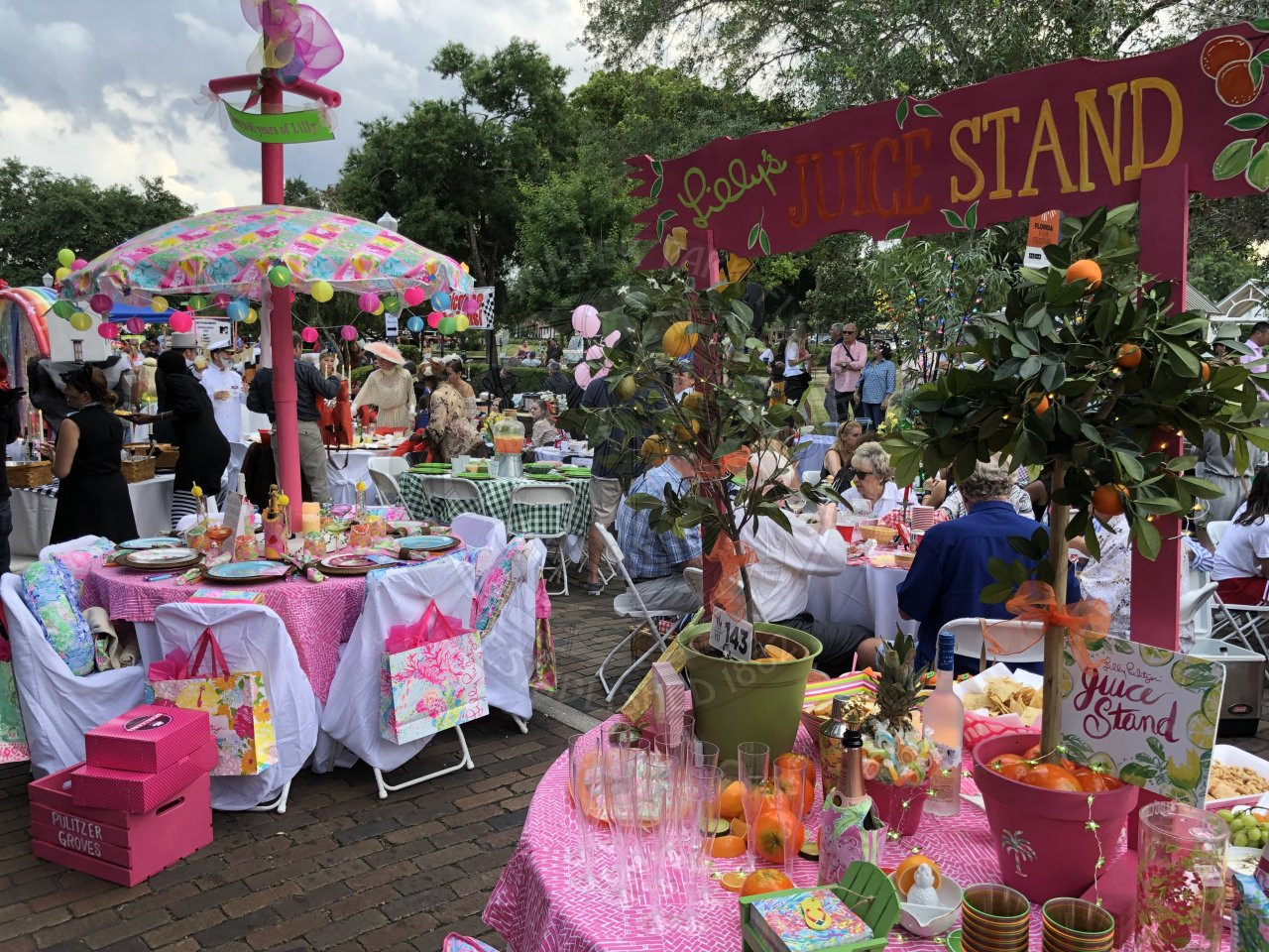 Lilly Pullitzer themed tables with a Lilly's juice stand sign.