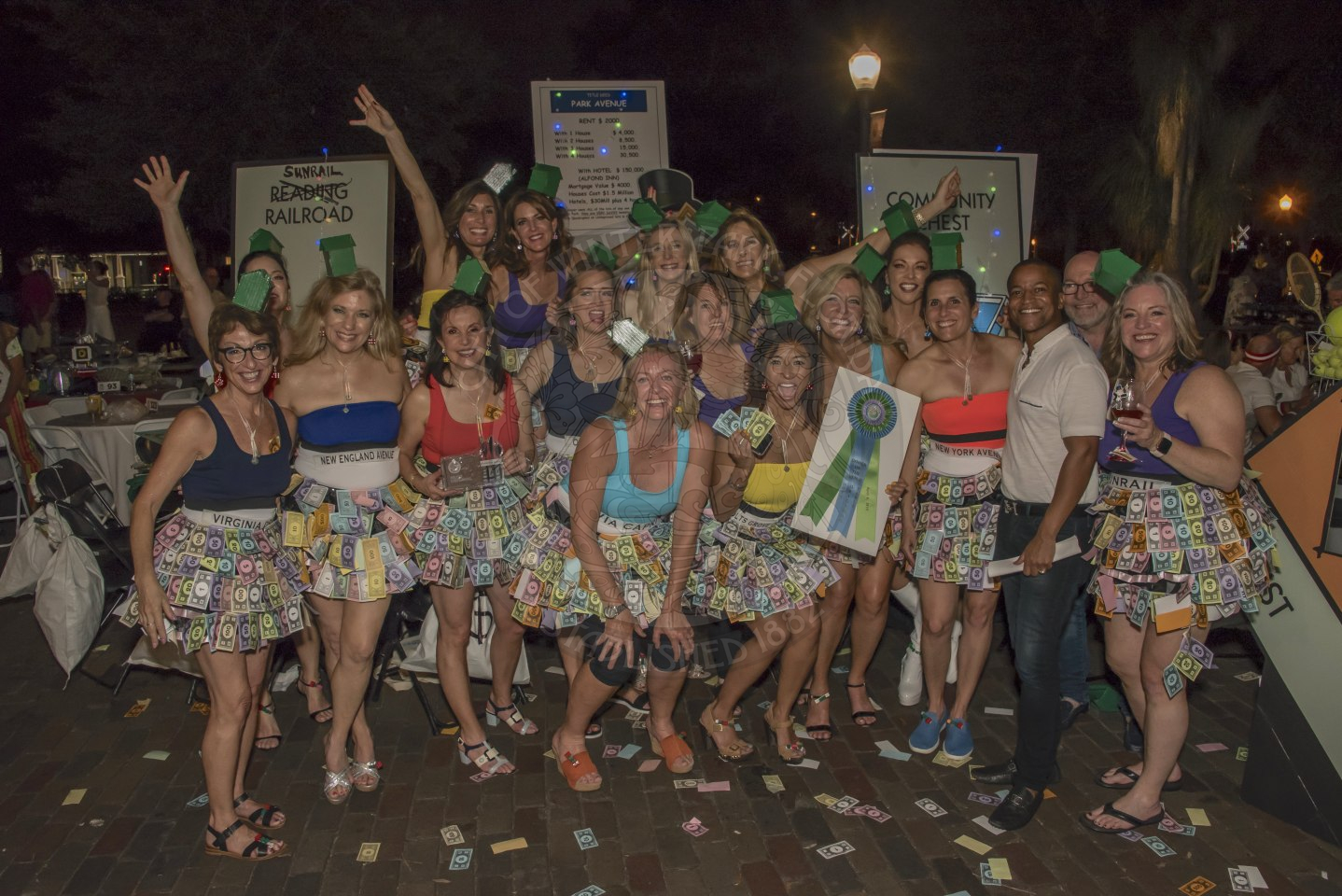 Group of people dressed in Monoploy themed clothing.