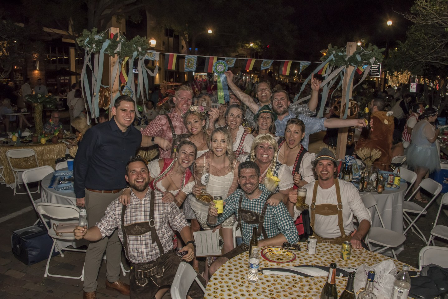 Group of people dressed in Oktoberfest themed clothing.