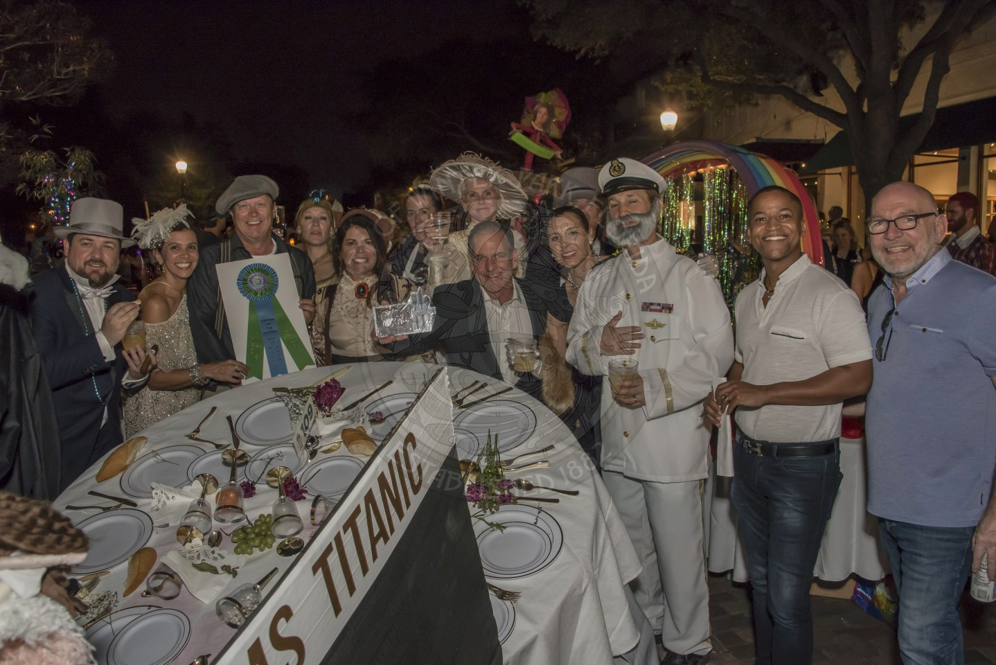Group of people dressed in Titanic themed clothing.