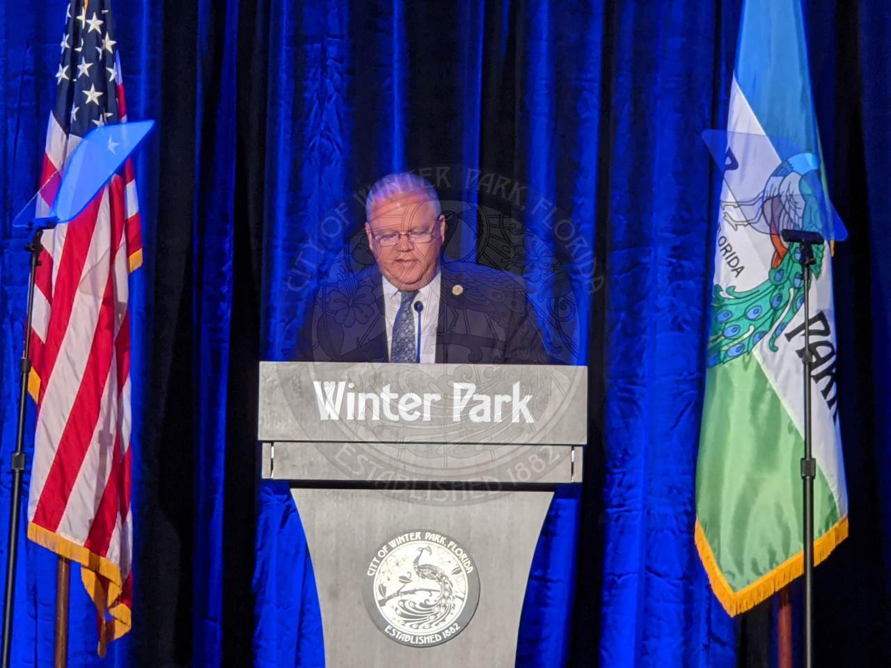 City Manager Randy Knight on stage behind the podium