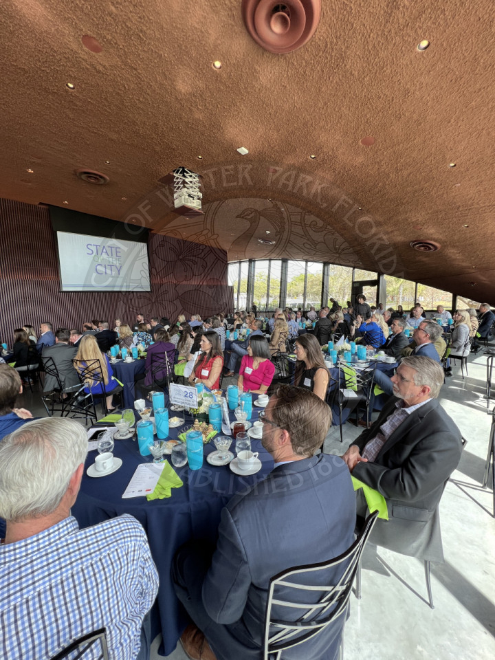 banquet hall with men and women sitting at tables