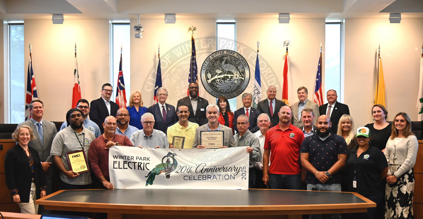 group shot of a bunch of electric utility staff and representatives