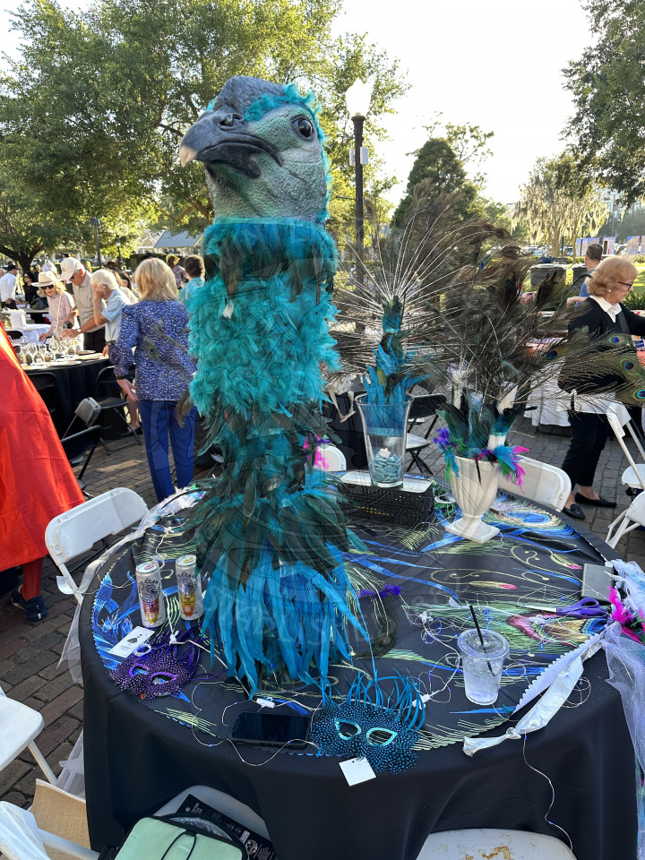 a peacock decorated table
