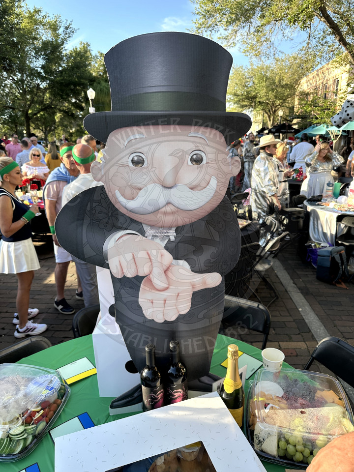 a giant cardboard cutout of the monopoly man