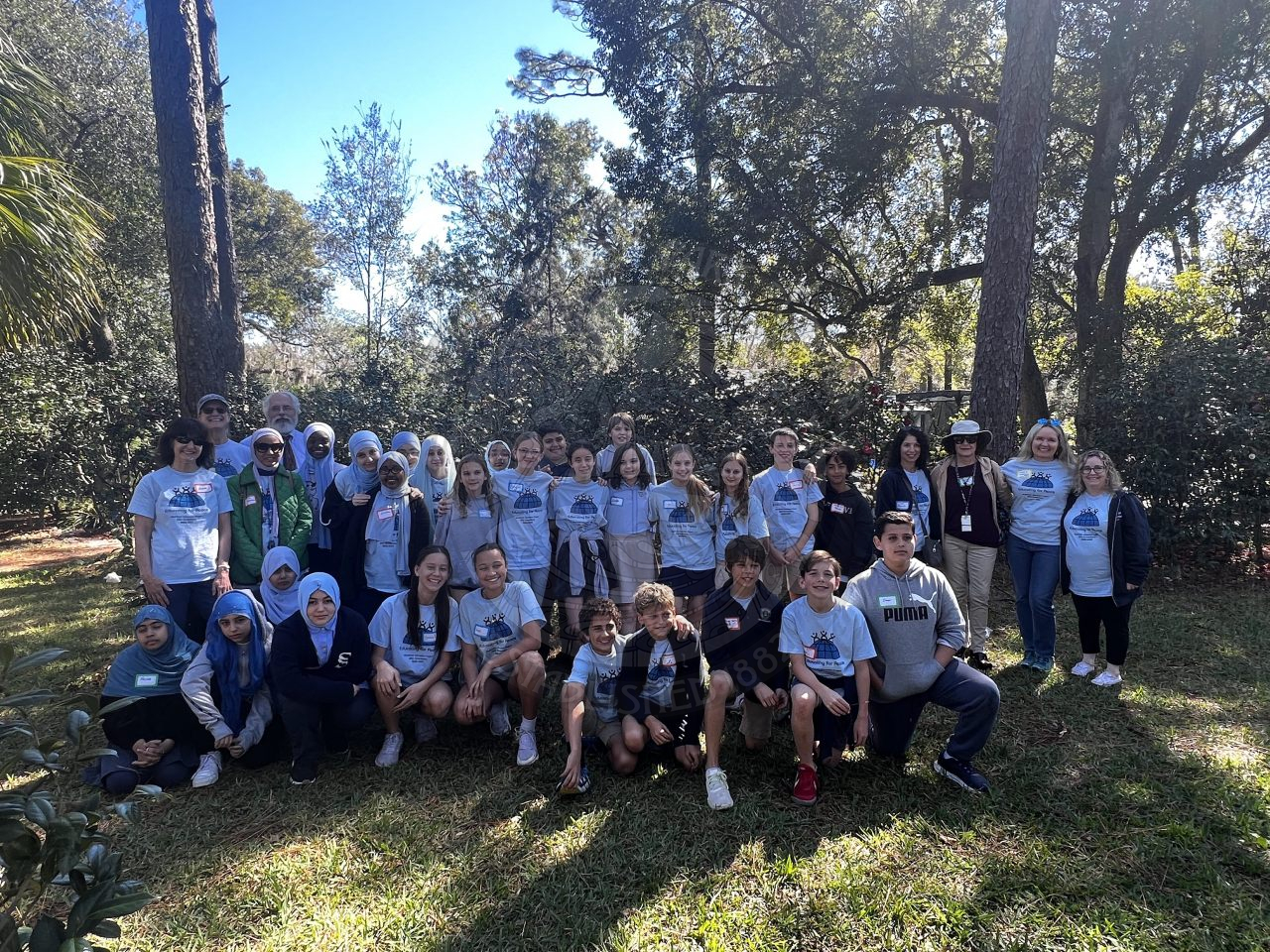 big group photo of kids smiling for the camera