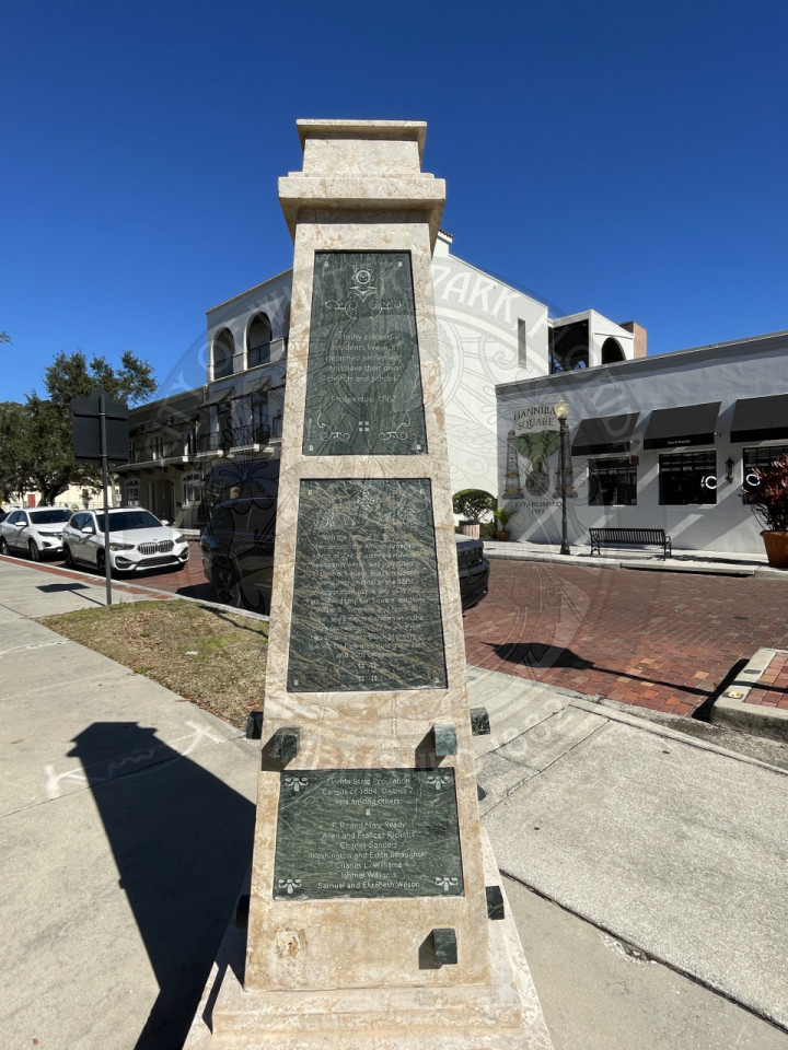 A statue with ure on it.