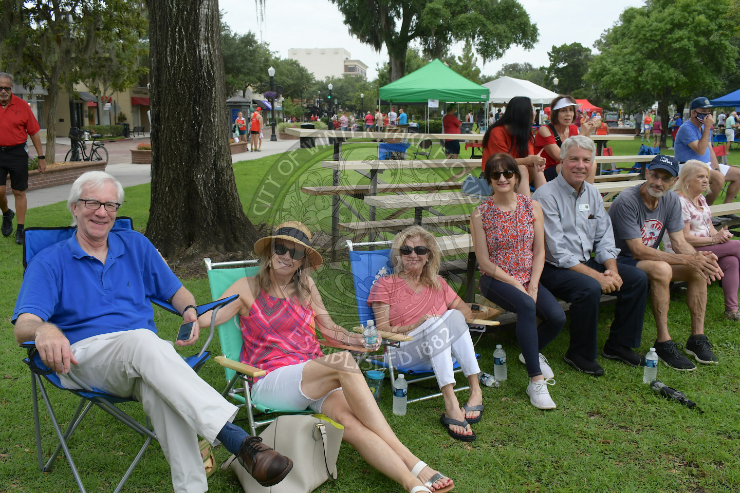 Mayor Anderson and his wife sitting with friends and other Commissioners