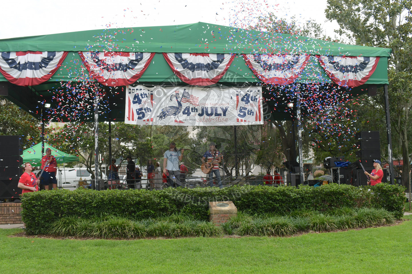 confetti shooting in front of the stage at the 4th of July celebration