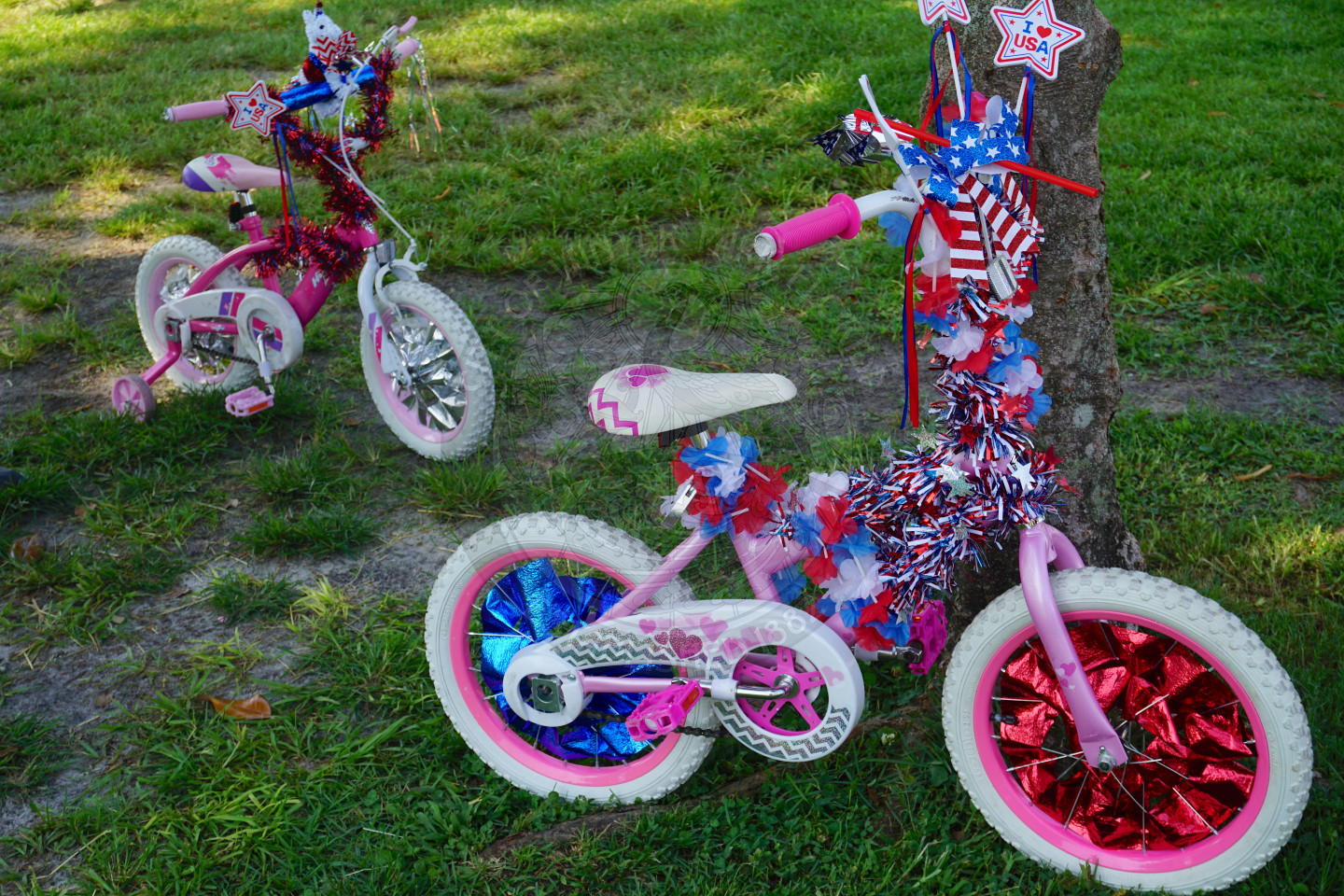 two bikes decorated with americana themed decorations