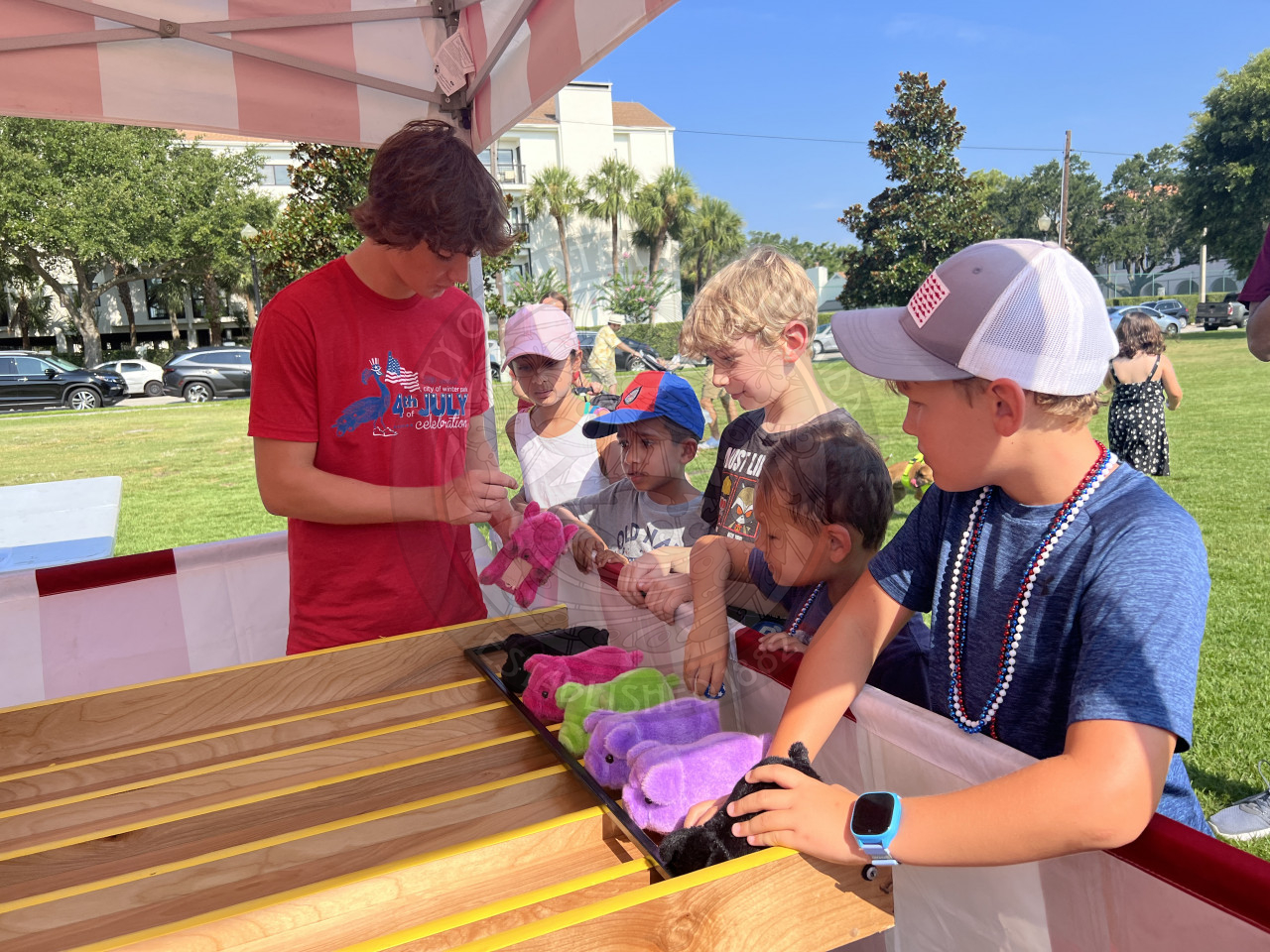 4 kids playing a carnival game