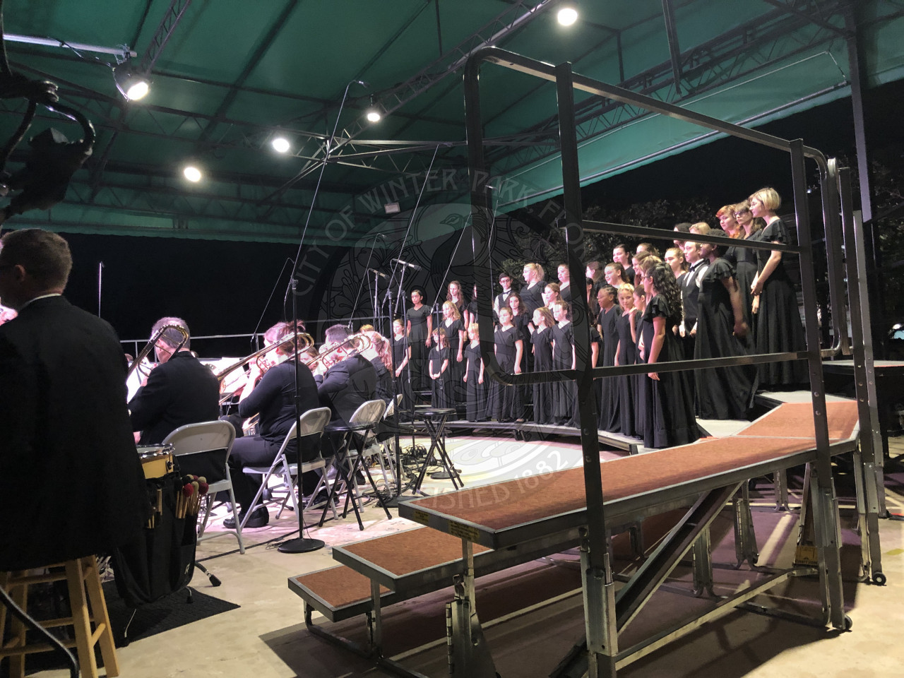 side view of the brass ensemble and choir on stage