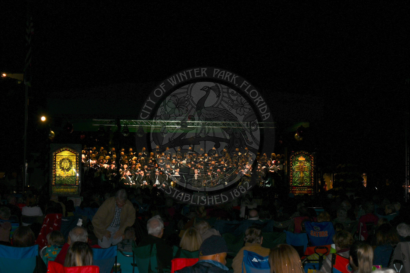 Bach Festival Society brass ensemble and choir on stage performing