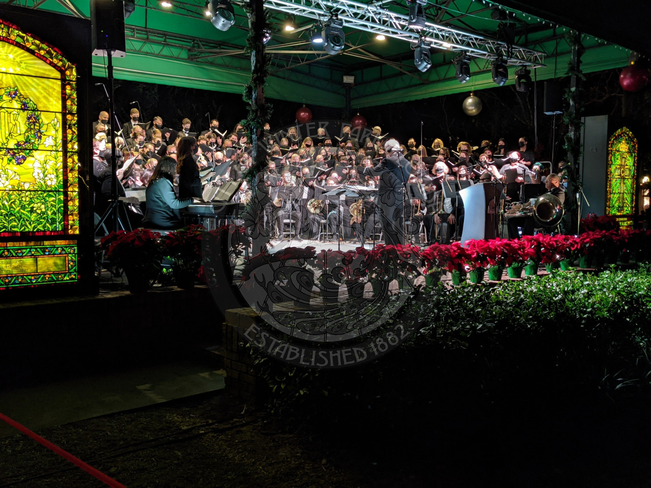 Bach Festival Society brass ensemble and choir on stage performing