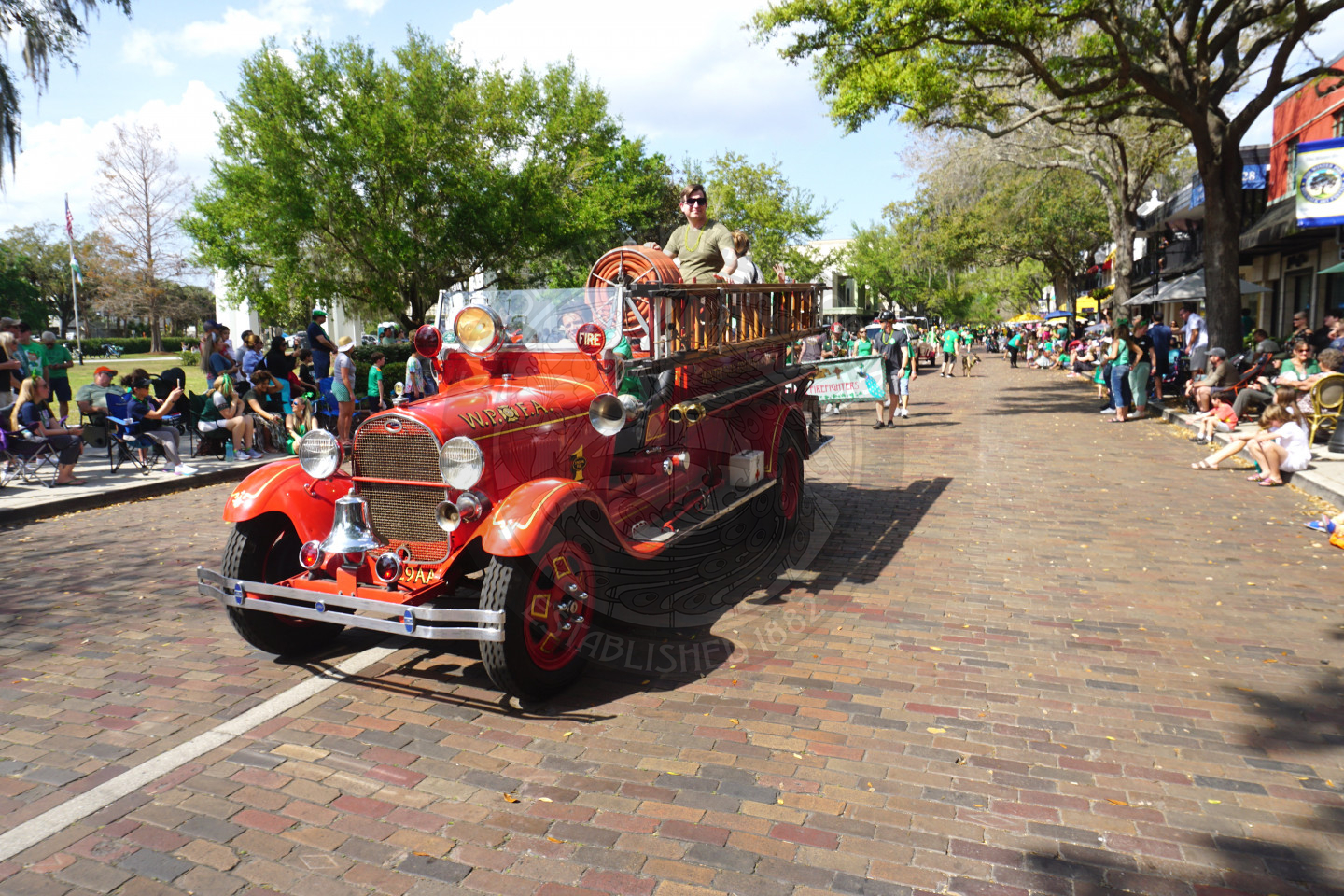 vintage firetruck rolling down park avenue