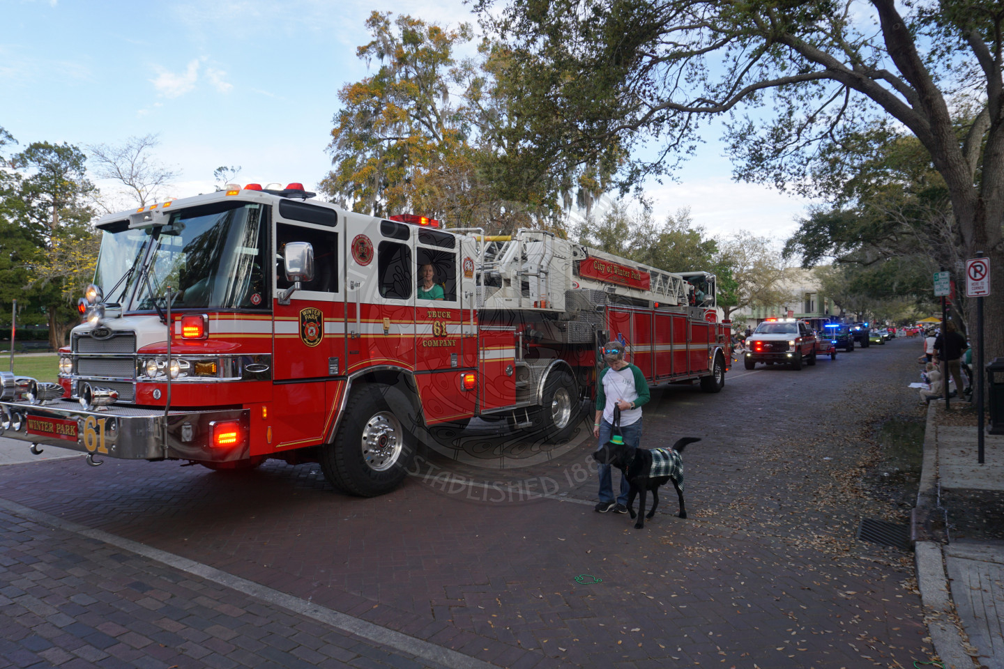 WPFD riding down a brick street.