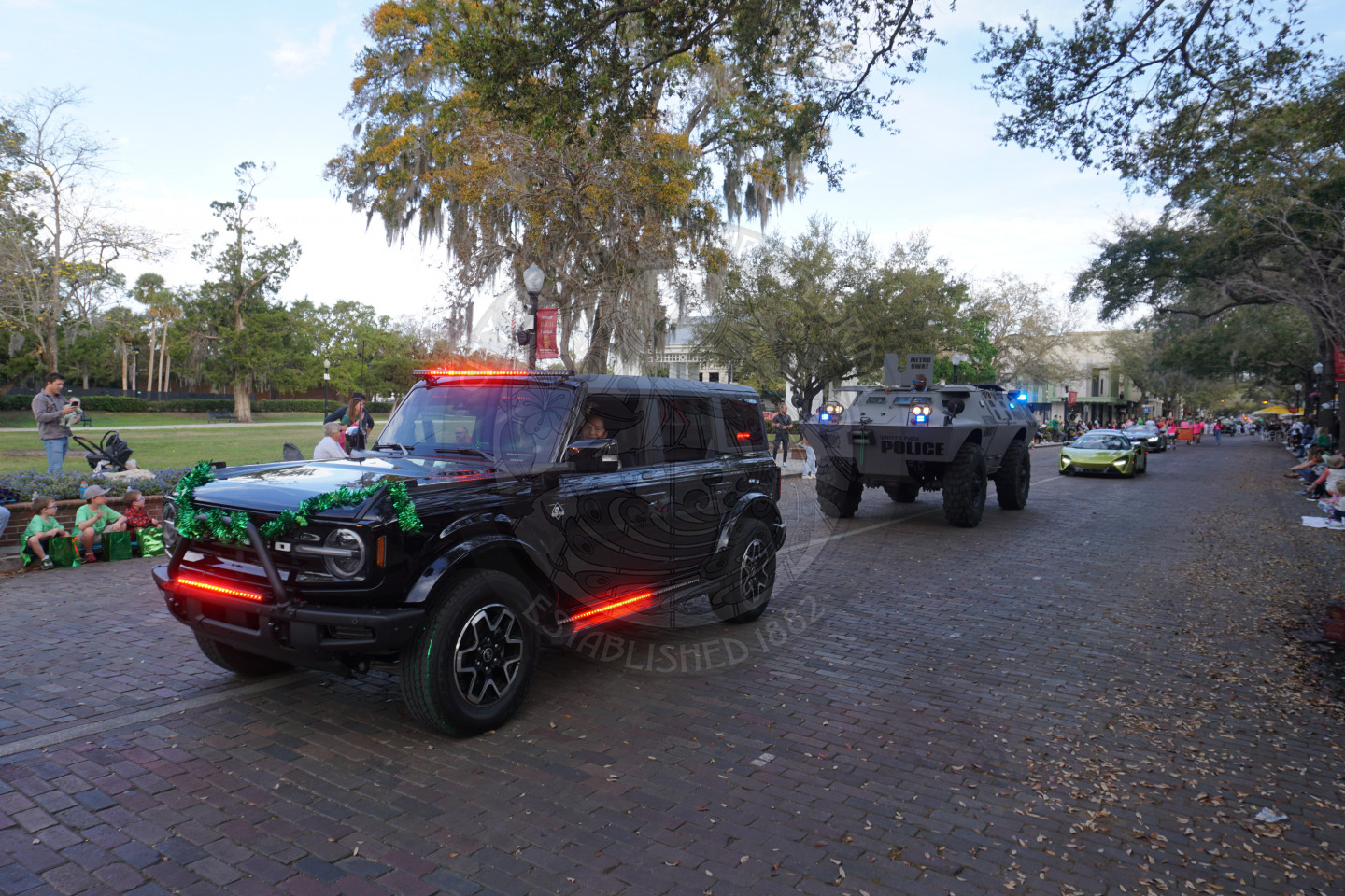 WPPD vehicles driving down a brick street.