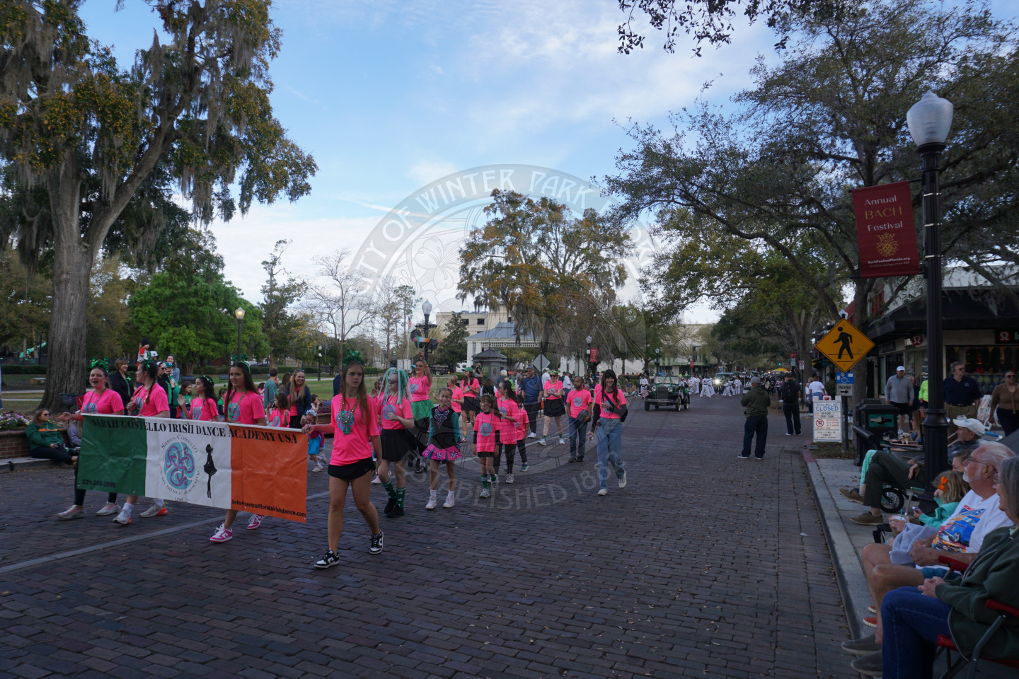 Irish Dance Academy walking down a brick street.