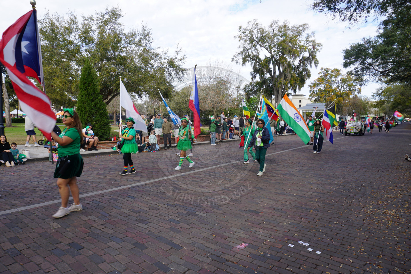 group of people waving different nationality flags.