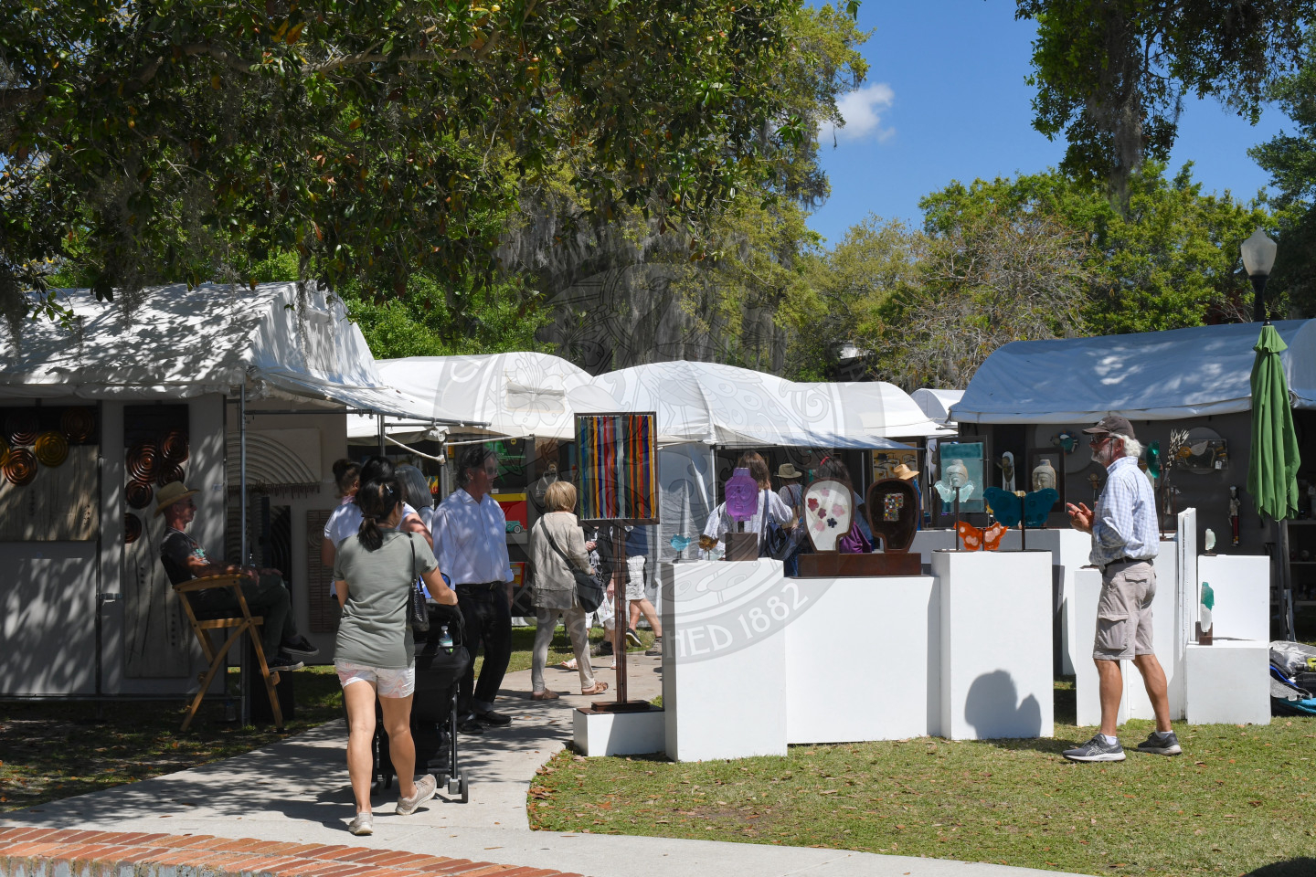people visiting artist booths at Winter Park Sidewalk Art Festival