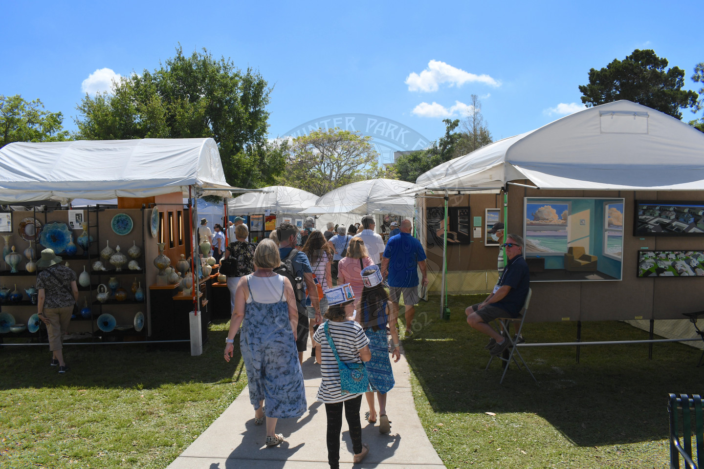 people visiting artist booths at Winter Park Sidewalk Art Festival