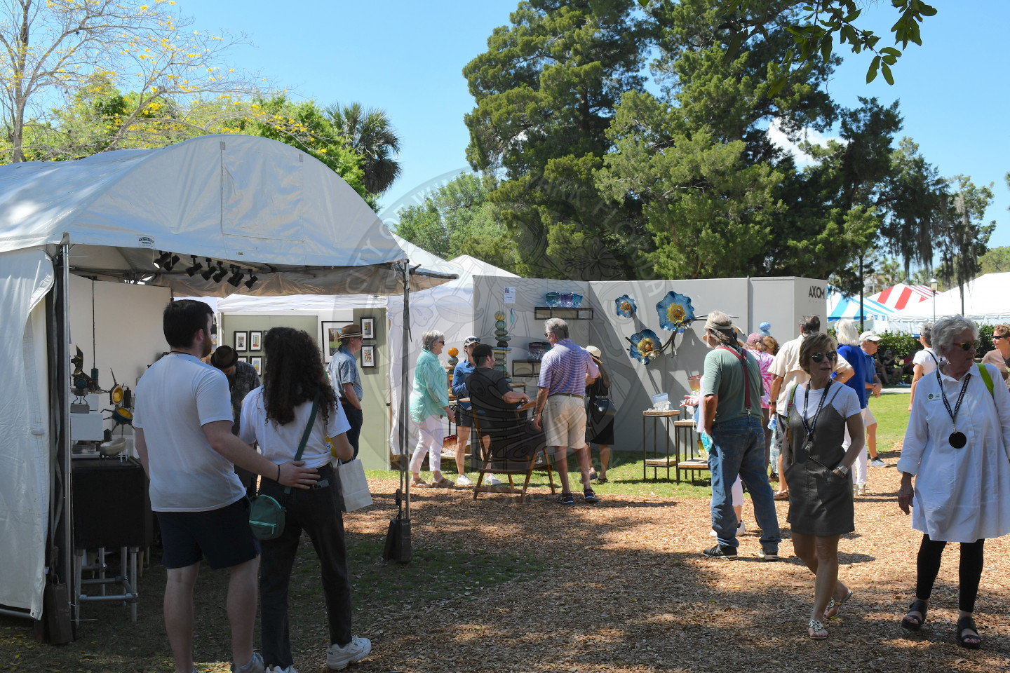 people visiting artist booths at Winter Park Sidewalk Art Festival