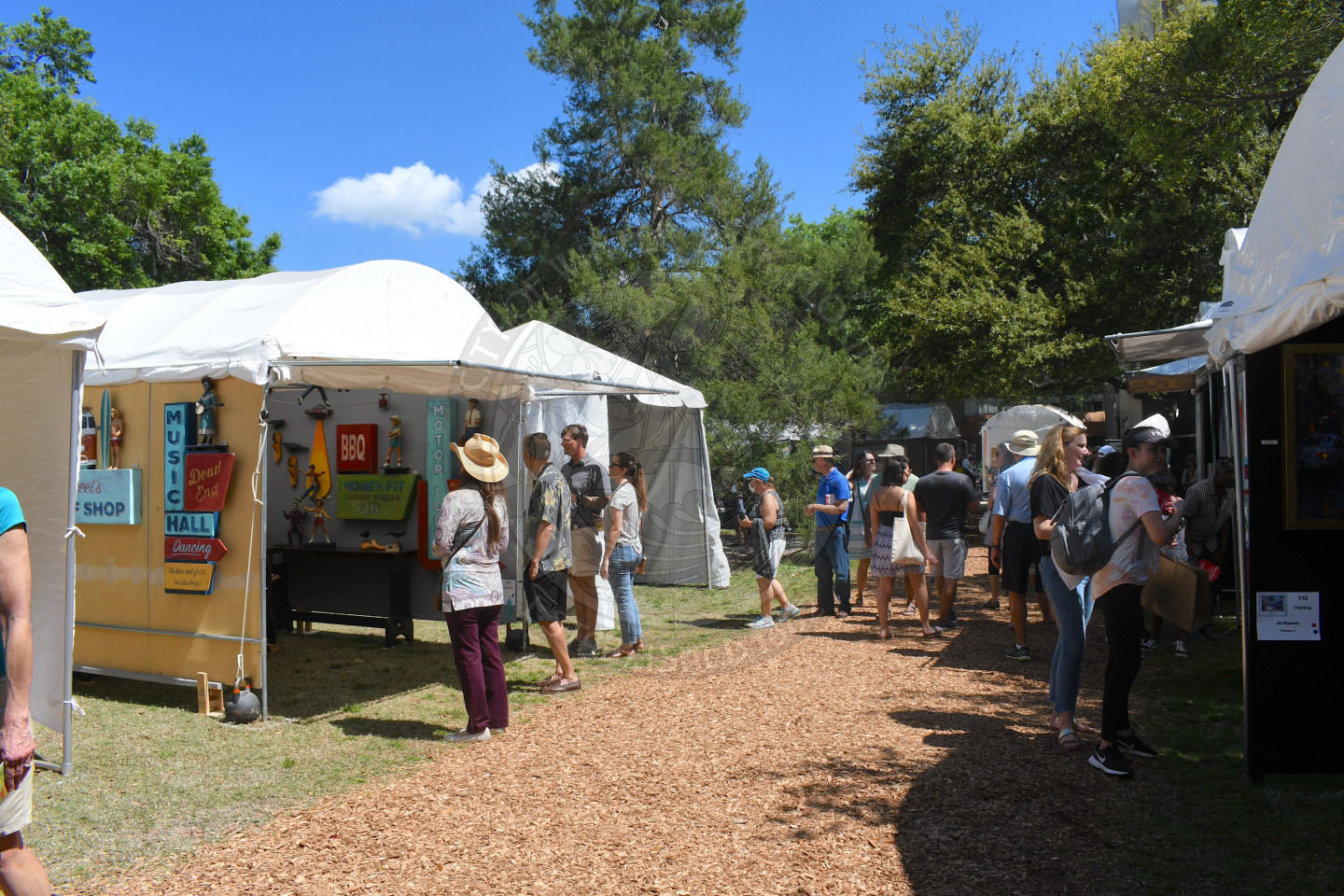 people visiting artist booths at Winter Park Sidewalk Art Festival