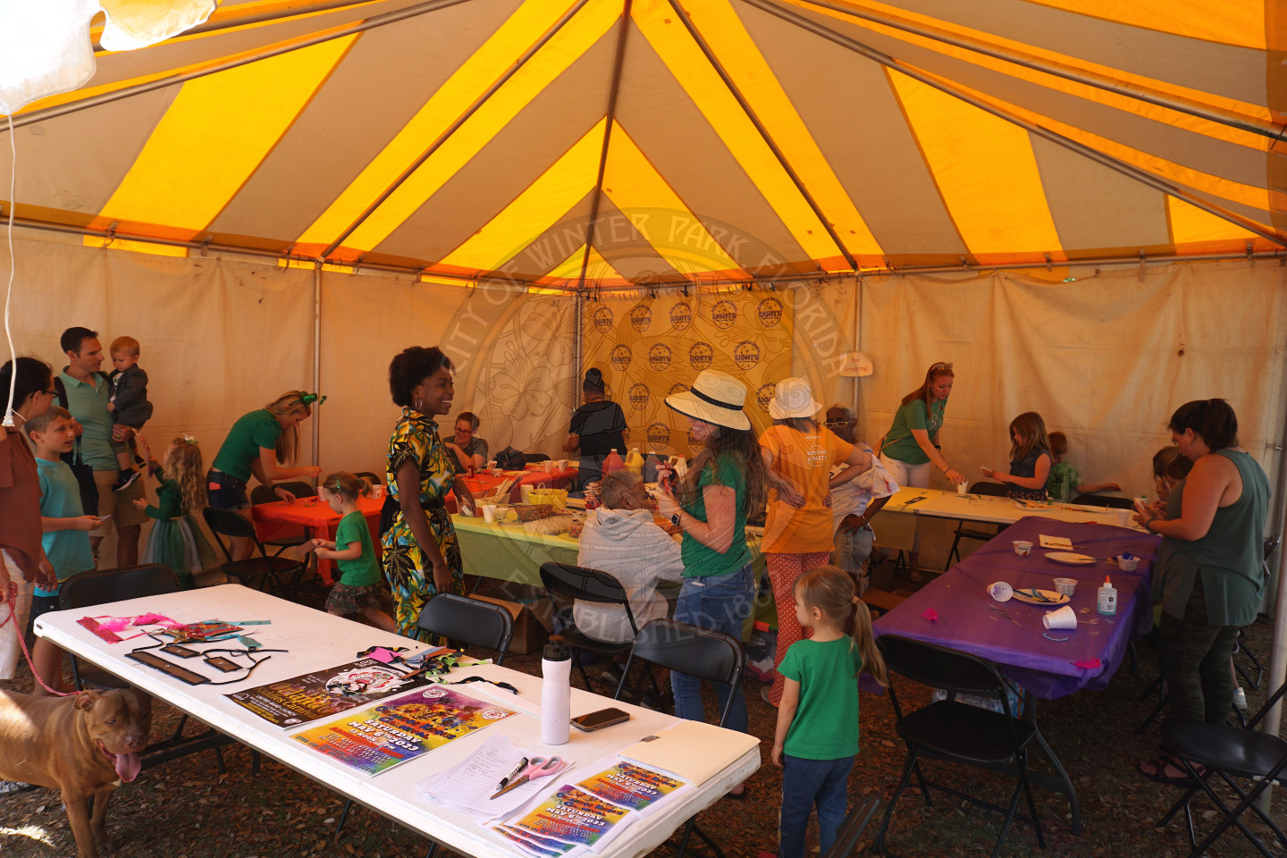 A big tent with crafts on the tables for kids to get creative.