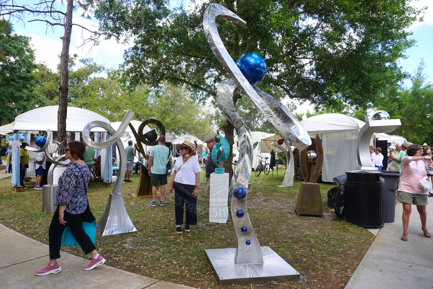 a few sculpture peices sitting in grass