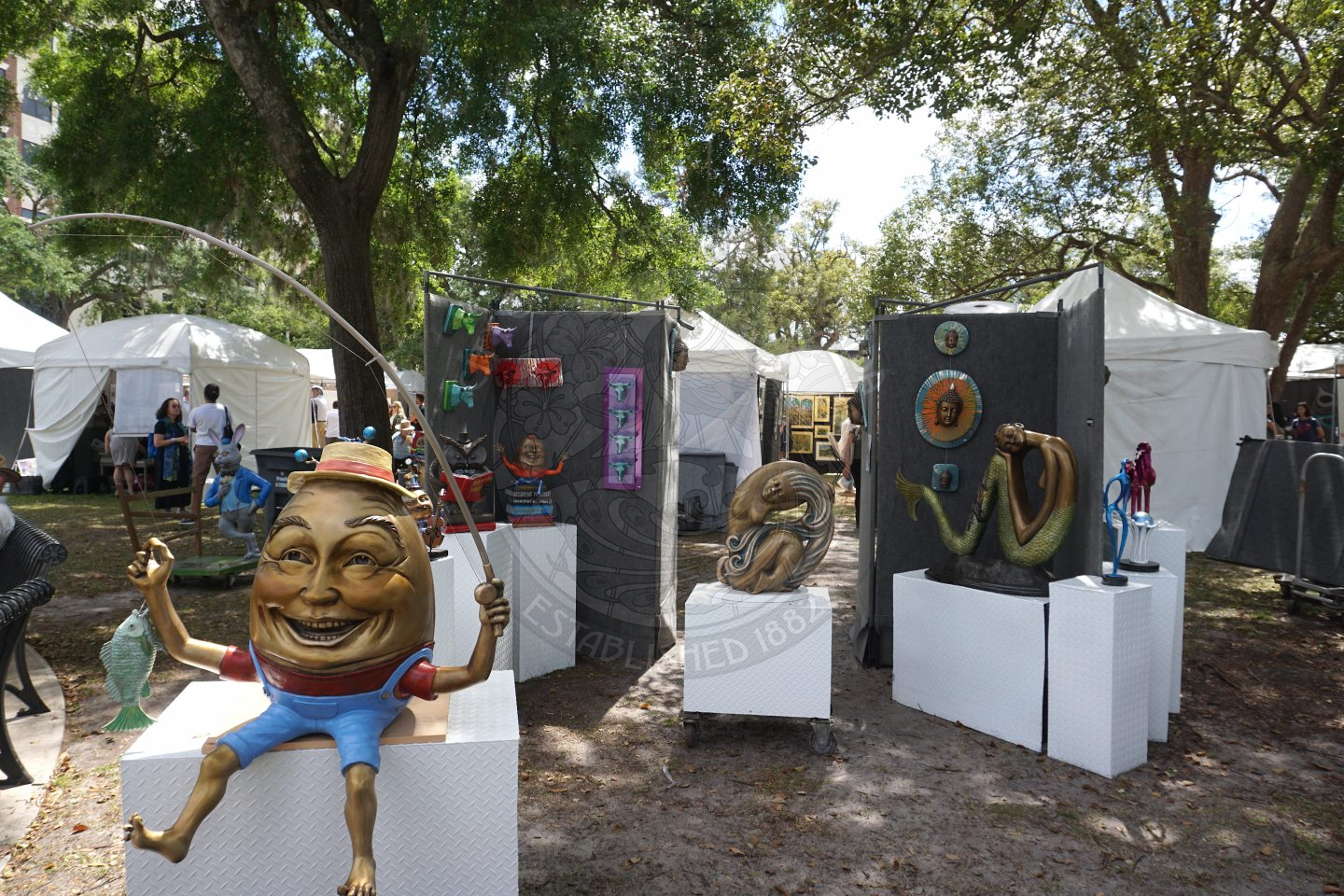 sculture setup with humpty dumty holding a fishing pole
