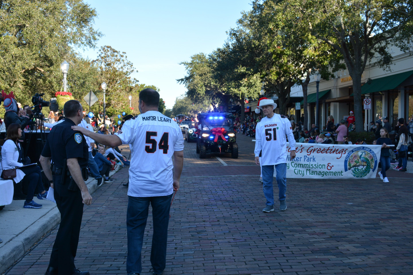 Mayor Leary with his hand on a police officers shoulder during the parade