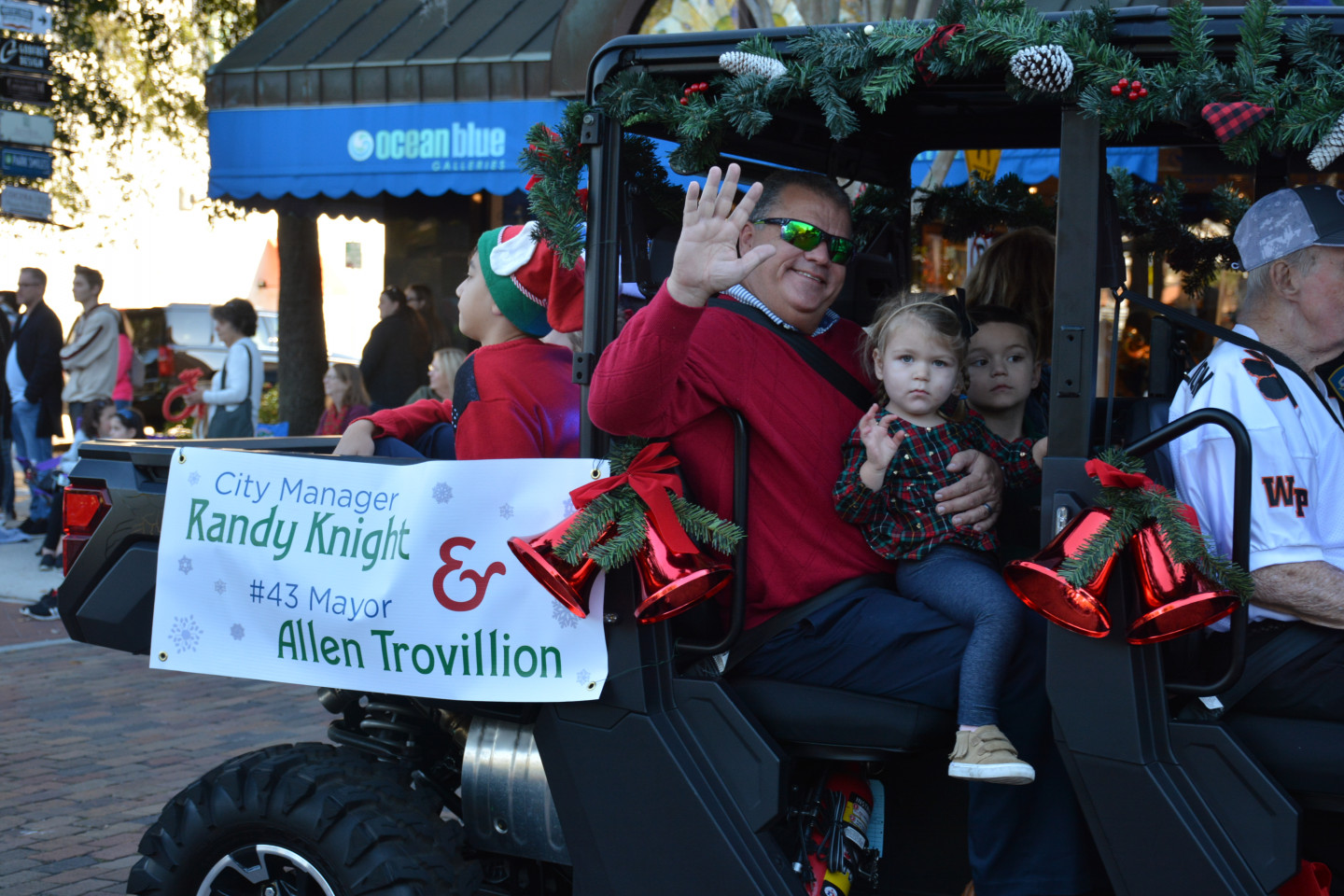 City Manager Randy Knight waving from the back of an ATV