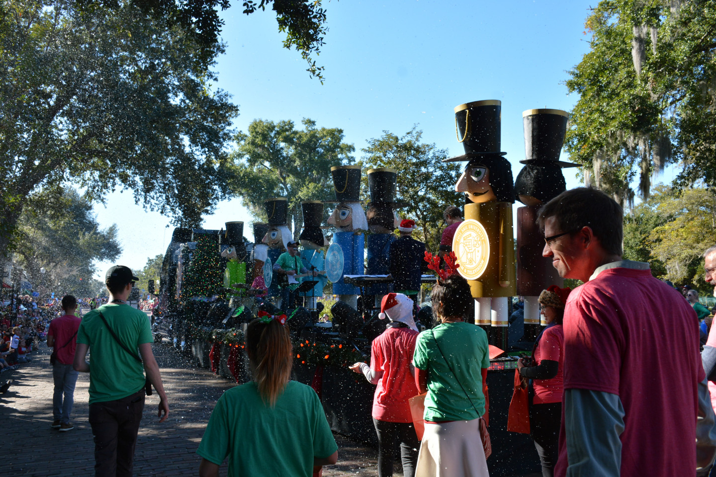 float during the parade with giant nutcrackers and snow falling