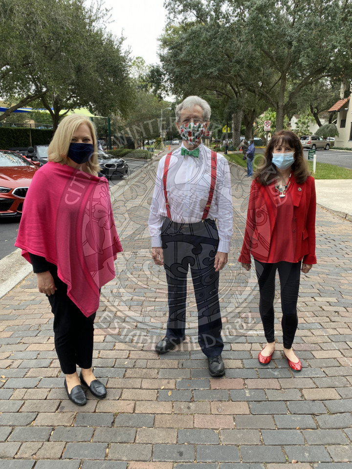 Assistant City Manager and two commissioners standing together with masks on