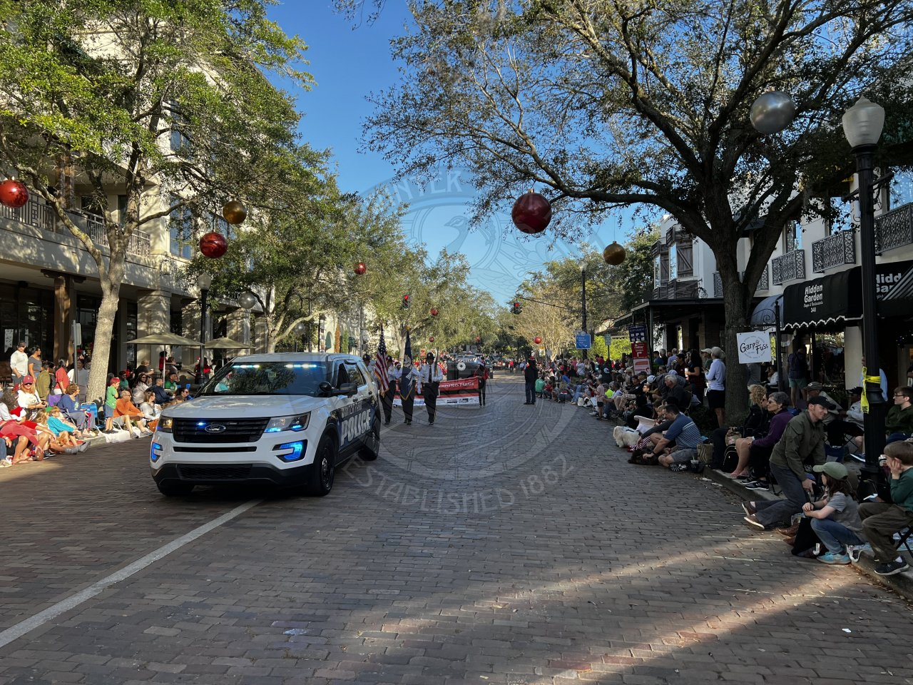 Winter Park Police Department driving down Park Avenue