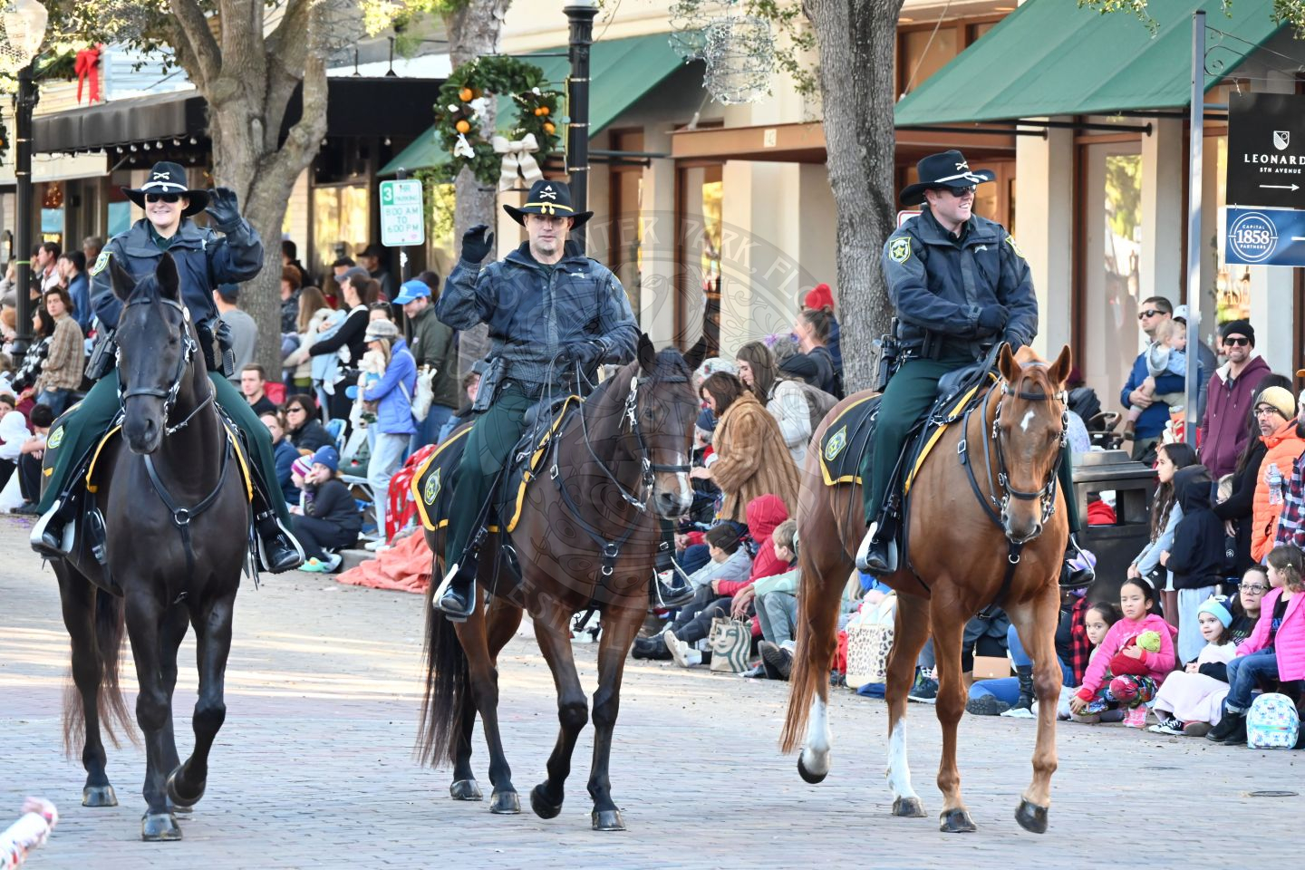 officers on horses trotting down park avenue.