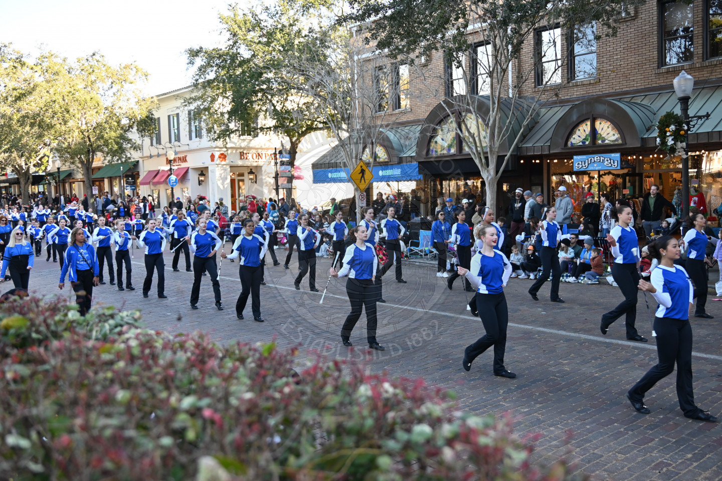 twirlers twirling their batons while marching down park avenue.