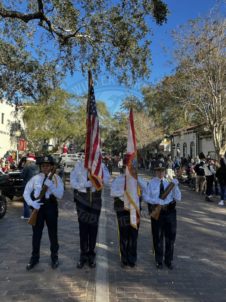 officers presenting the colors at the beginning of the parade.