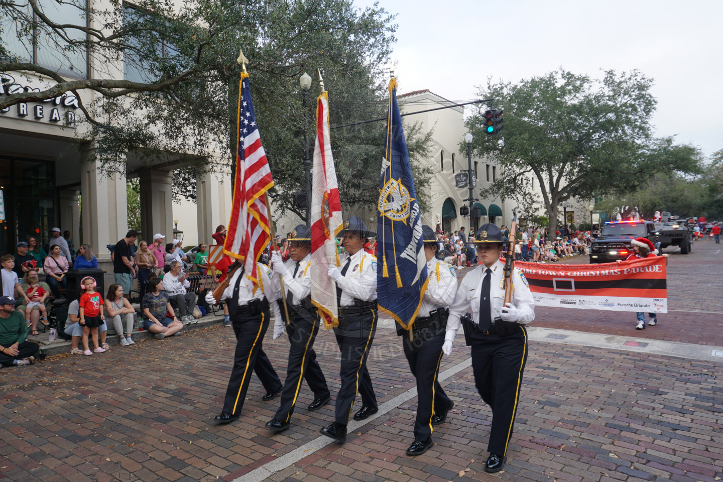 color guard walking in position through the parade route.