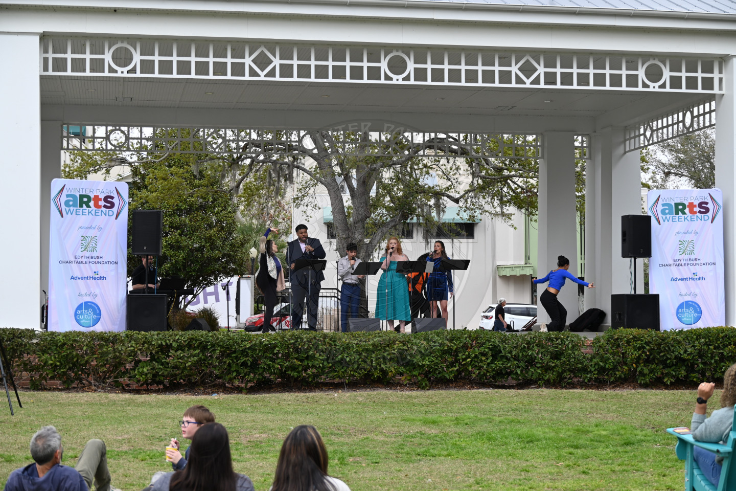 A group of people singing on stage.