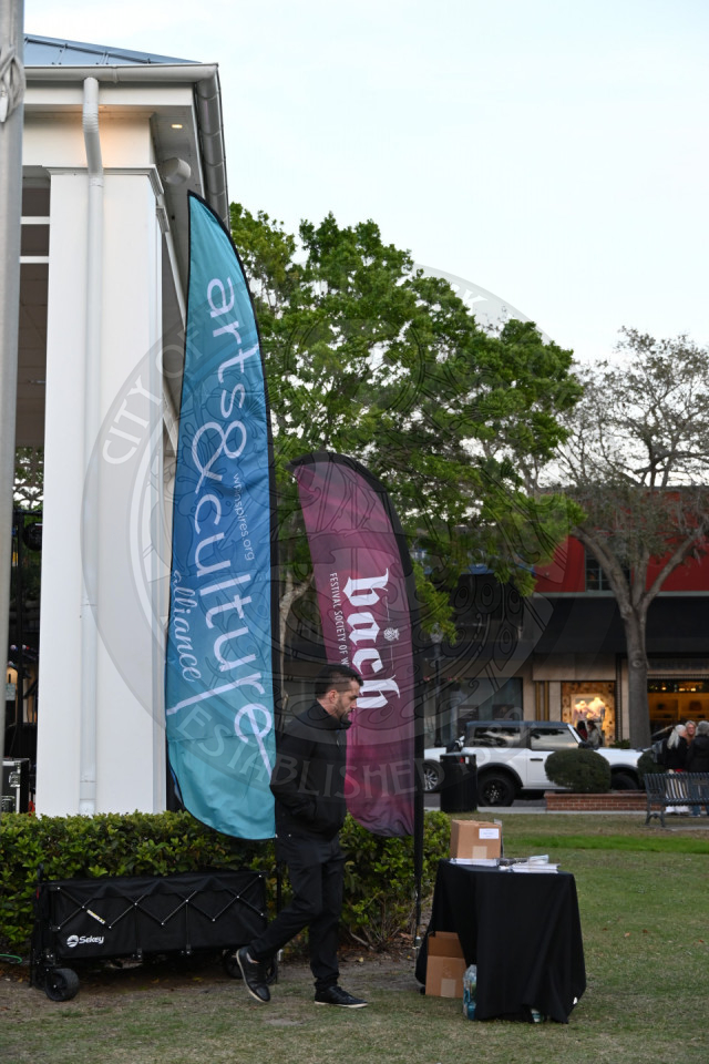 banners that say Bach and arts &amp; culture alliance with a table next to them with information on bach music society.
