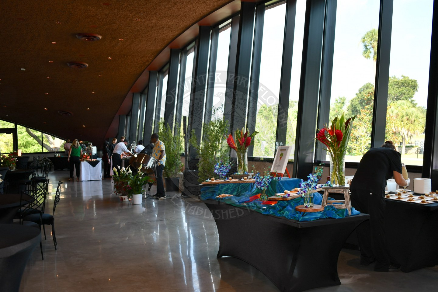 Food displays and to the left is the steel drum man.