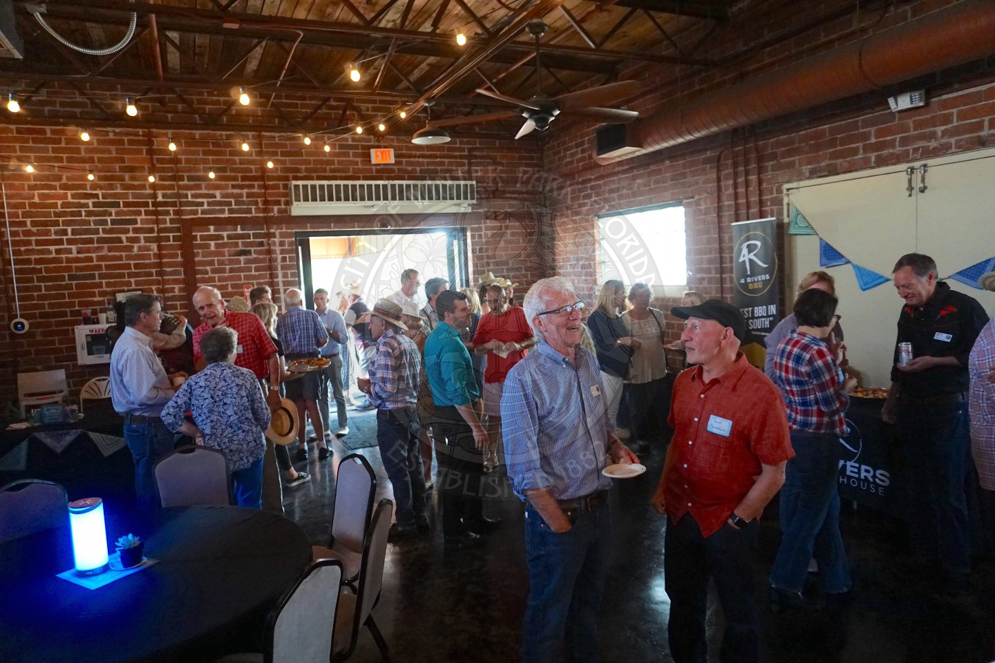 candid shot of a lot of people mingling at the farmers' market